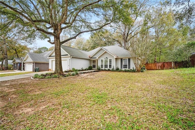 single story home featuring a front yard, concrete driveway, an attached garage, and fence