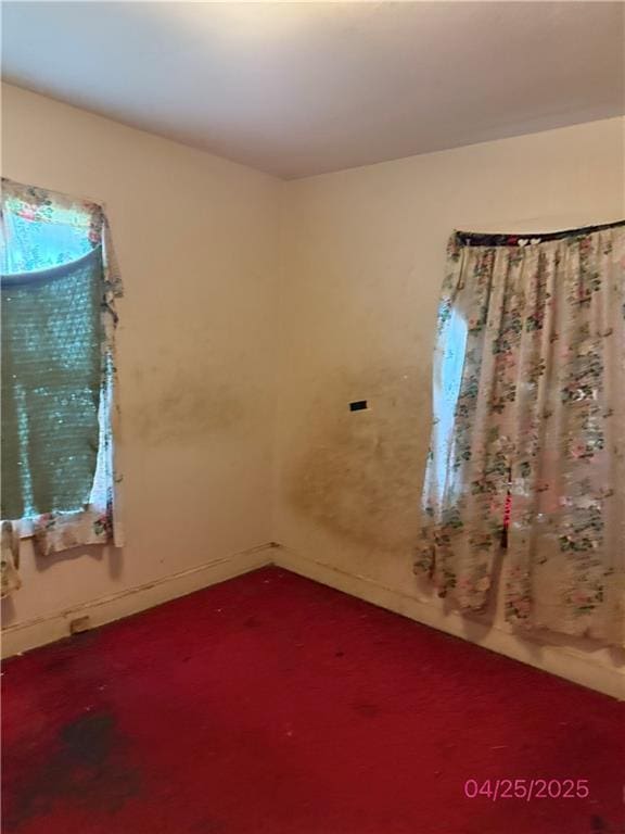 557 Kent St, Mobile, AL 36617 - empty room with carpet and baseboards