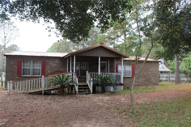 view of front of property featuring covered porch