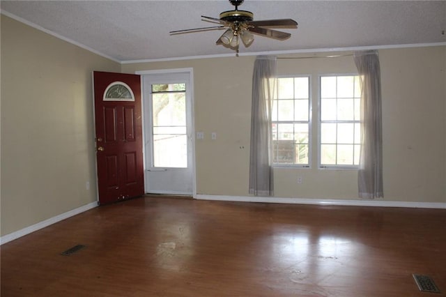 foyer with hardwood / wood-style floors, ceiling fan, crown molding, and a textured ceiling