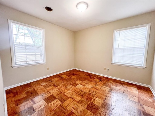 empty room with light parquet flooring