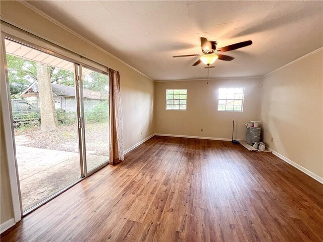 2602 Eldorado Dr, Mobile, AL 36605 - spare room with crown molding, wood finished floors, ceiling fan, and baseboards