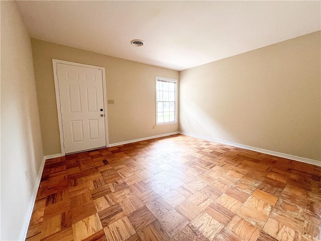 empty room with light parquet floors