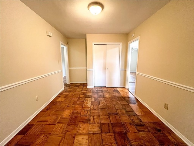 corridor featuring dark parquet floors