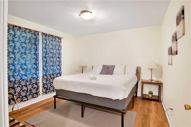 bedroom with light hardwood / wood-style floors