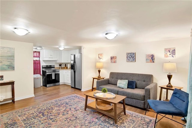 living room with light hardwood / wood-style flooring