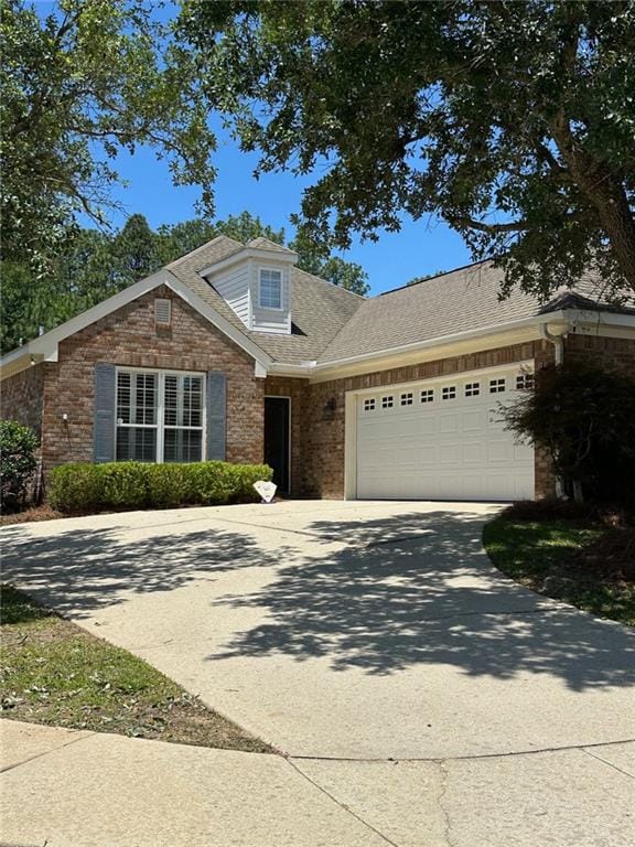 6645 Somerby Ln, Mobile, AL 36695 - view of front of home featuring brick siding, concrete driveway, and a garage