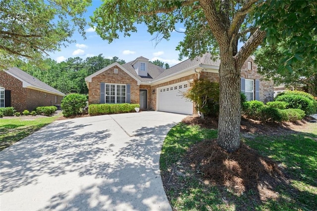 6645 Somerby Ln, Mobile, AL 36695 - traditional-style house featuring an attached garage, driveway, and brick siding