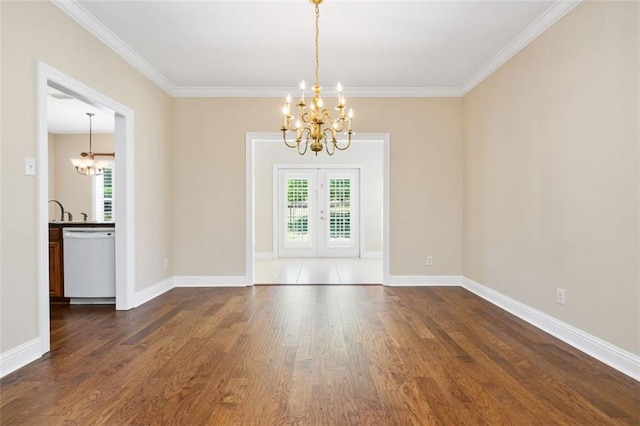 6645 Somerby Ln, Mobile, AL 36695 - spare room featuring a chandelier, dark wood-style flooring, french doors, crown molding, and baseboards