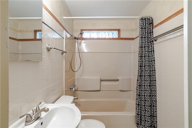 full bathroom featuring toilet, sink, and shower / bath combo with shower curtain