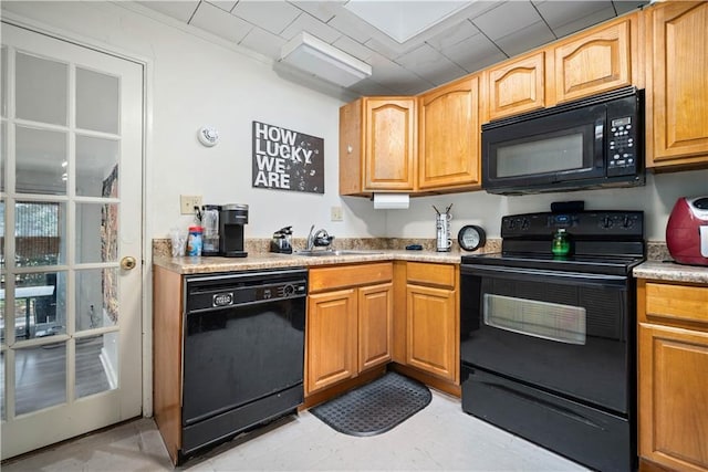 kitchen featuring sink and black appliances