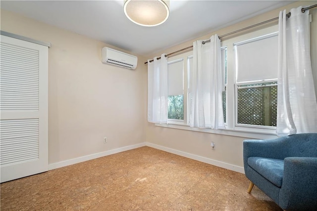 sitting room with an AC wall unit