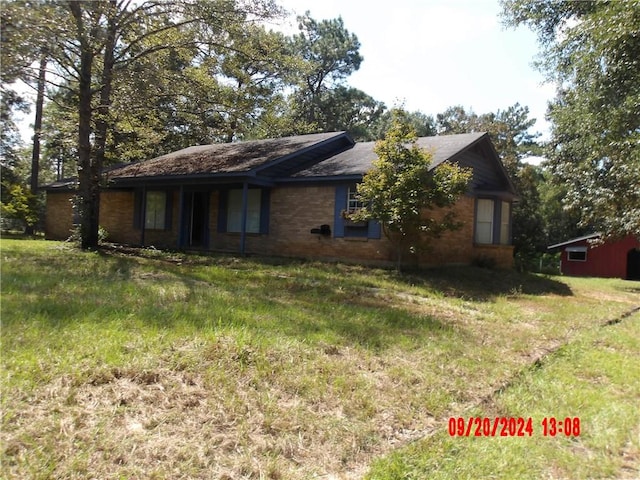 view of property exterior with a yard