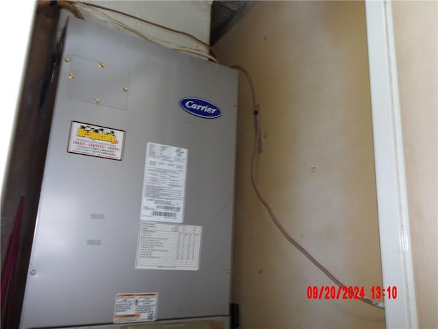 utility room with heating unit