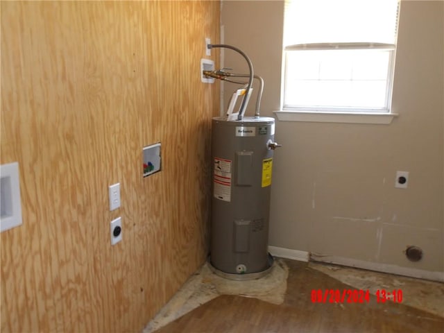 utility room featuring electric water heater