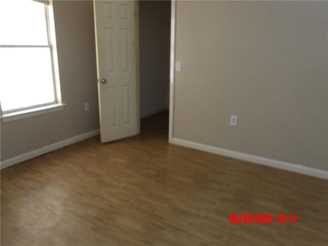 unfurnished bedroom with wood-type flooring