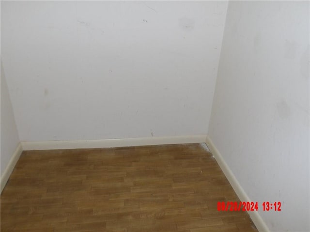 spare room featuring dark hardwood / wood-style flooring