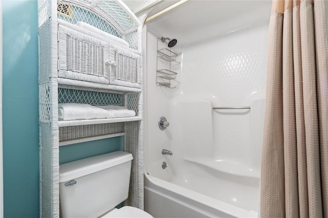 633 Beach Blvd Unit 205, Gulf Shores, AL 36542 - bathroom featuring shower / bath combo with shower curtain and toilet