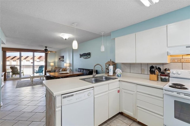 633 Beach Blvd Unit 205, Gulf Shores, AL 36542 - kitchen featuring white appliances, ventilation hood, a sink, open floor plan, and a peninsula
