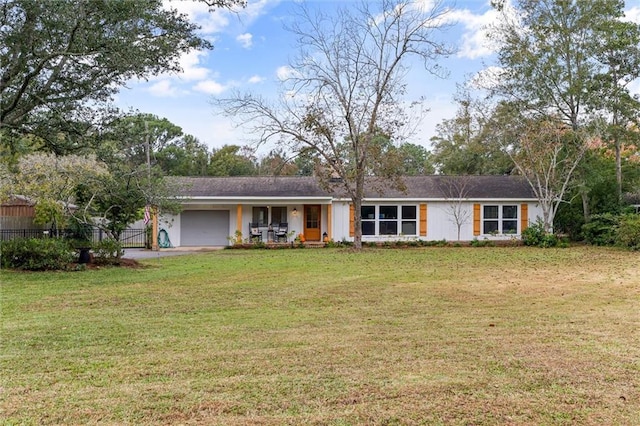 ranch-style home with a garage and a front lawn