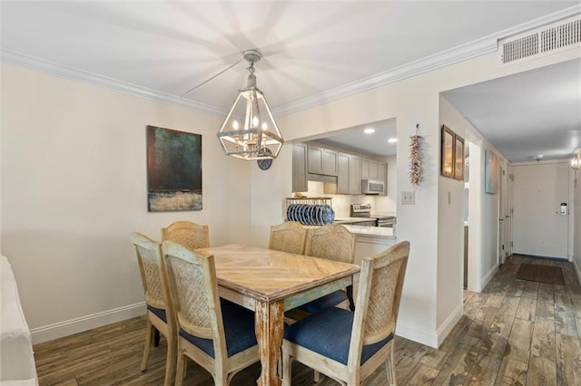 1051 Beach Blvd W Unit 9B, Gulf Shores, AL 36542 - dining space featuring a chandelier, wood finished floors, and crown molding
