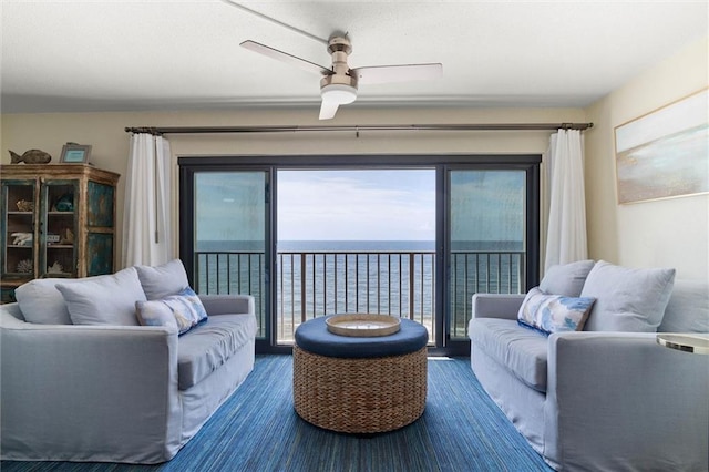 1051 Beach Blvd W Unit 9B, Gulf Shores, AL 36542 - living area with ceiling fan and a water view