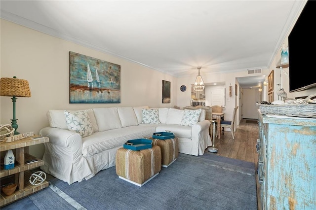 1051 Beach Blvd W Unit 9B, Gulf Shores, AL 36542 - living area with a chandelier, crown molding, and wood-type flooring