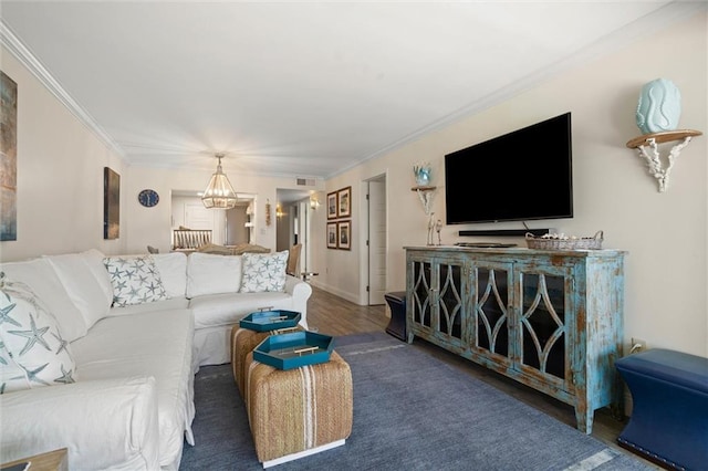 1051 Beach Blvd W Unit 9B, Gulf Shores, AL 36542 - living room featuring a chandelier, wood finished floors, and ornamental molding