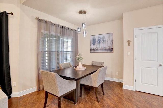 dining room with hardwood / wood-style floors