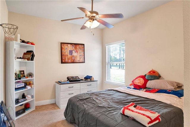 bedroom with ceiling fan and light colored carpet