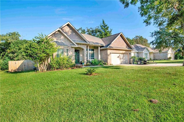 craftsman house featuring a garage and a front lawn