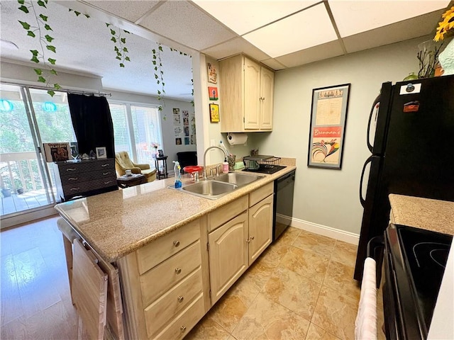 2081 Sea Cliff Dr N Unit 2B, Daphne, AL 36526 - kitchen featuring a sink, black appliances, baseboards, light countertops, and a drop ceiling