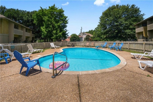 2081 Sea Cliff Dr N Unit 2B, Daphne, AL 36526 - community pool featuring a patio area and fence