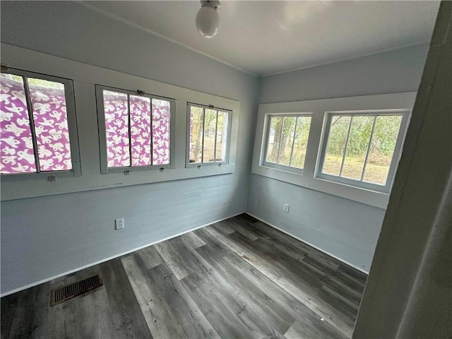 unfurnished room featuring dark wood-type flooring