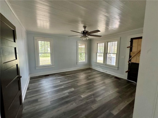 empty room featuring ceiling fan, plenty of natural light, crown molding, and wooden ceiling