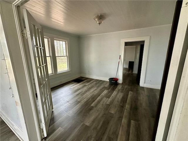 unfurnished room with dark hardwood / wood-style flooring