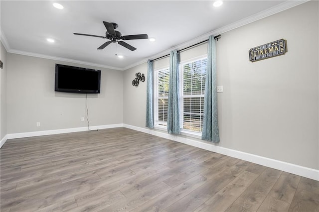 unfurnished room with ceiling fan, ornamental molding, and light hardwood / wood-style flooring