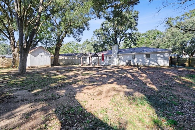 view of yard with a storage unit