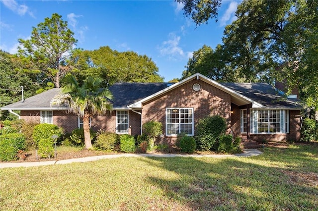 single story home featuring a front yard