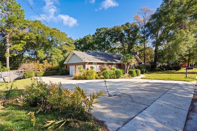 view of front facade featuring a front yard and a garage