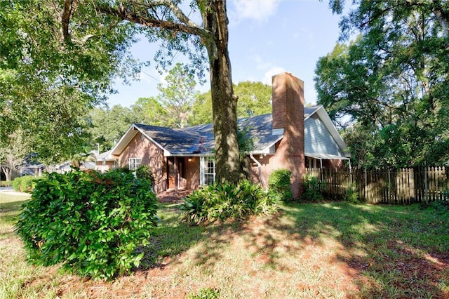 exterior space featuring a front lawn