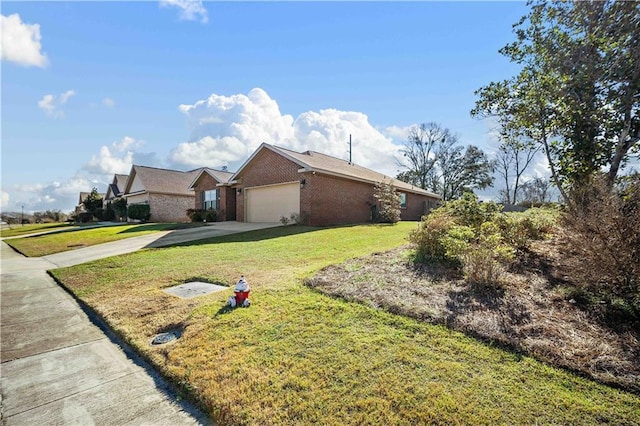 view of front facade with a front yard and a garage