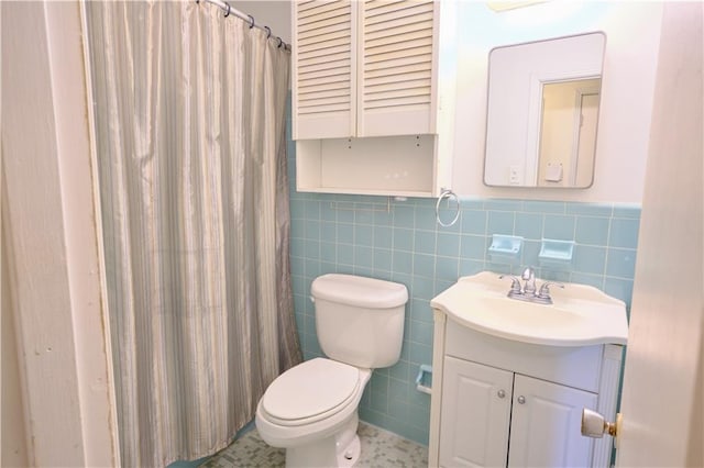 bathroom with toilet, backsplash, tile patterned flooring, tile walls, and vanity