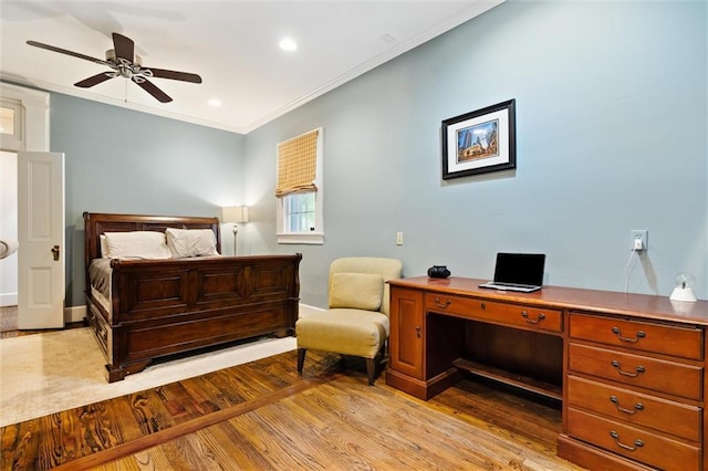 bedroom with ceiling fan, ornamental molding, and light hardwood / wood-style flooring