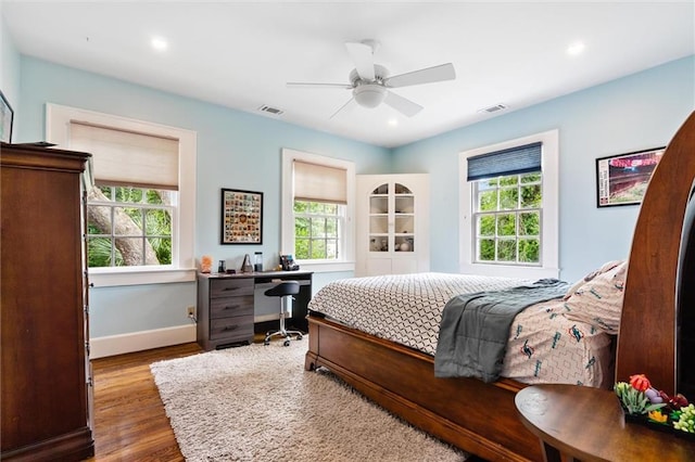 bedroom with hardwood / wood-style floors and ceiling fan