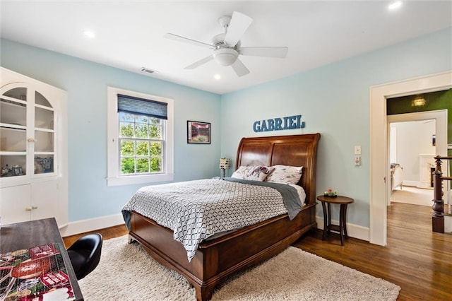 bedroom featuring ceiling fan and dark hardwood / wood-style flooring