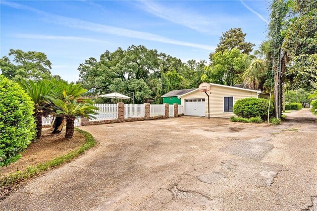 view of side of property featuring a garage and an outdoor structure