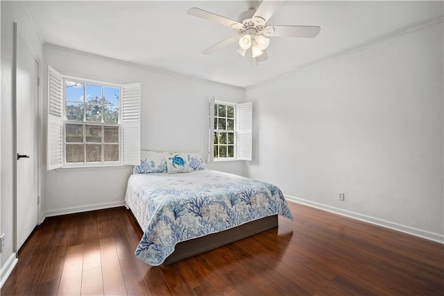 bedroom with ceiling fan, wood-type flooring, and baseboards