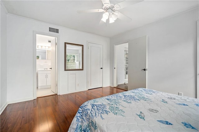 bedroom with wood-type flooring, visible vents, ceiling fan, and baseboards