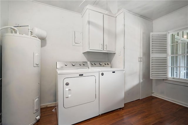 washroom with dark wood-style floors, cabinet space, washing machine and clothes dryer, and water heater